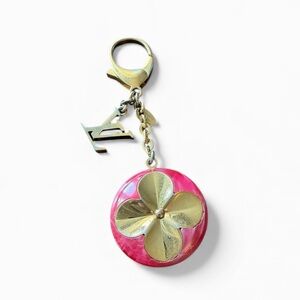 Louis Vuitton Hollow Flower Bag Charm – Fuchsia Resin & Gold-Tone Brass